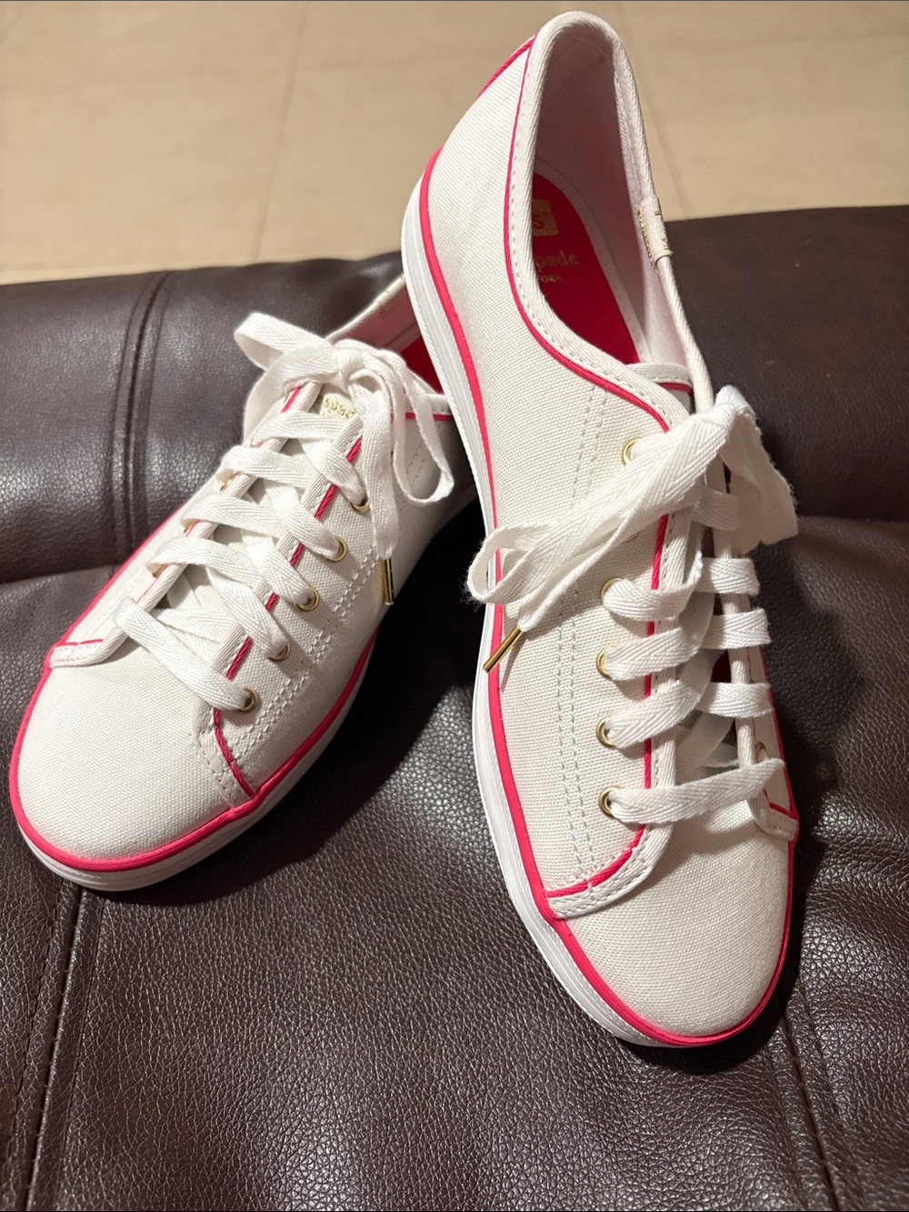 Keds Women's White Canvas Sneakers with Pink Trim, size 8.5.